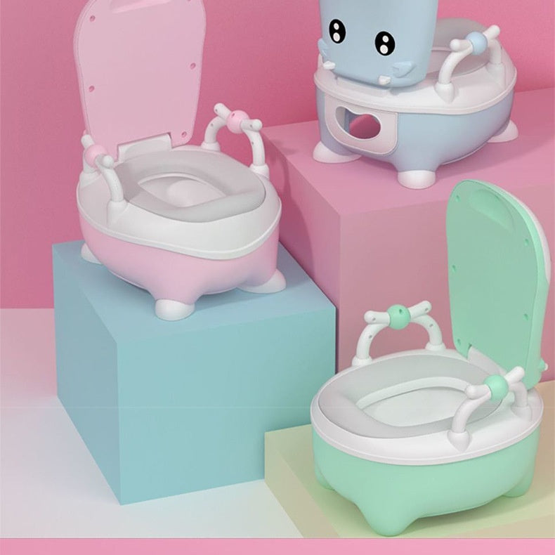 Three colorful children's potty seats on a pink and blue background