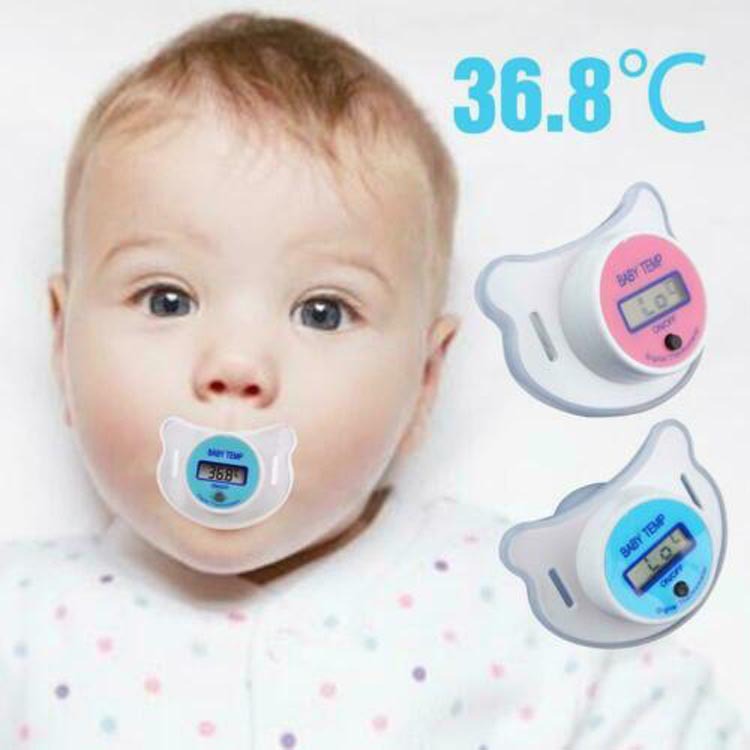 Baby with digital pacifier thermometer on a white background